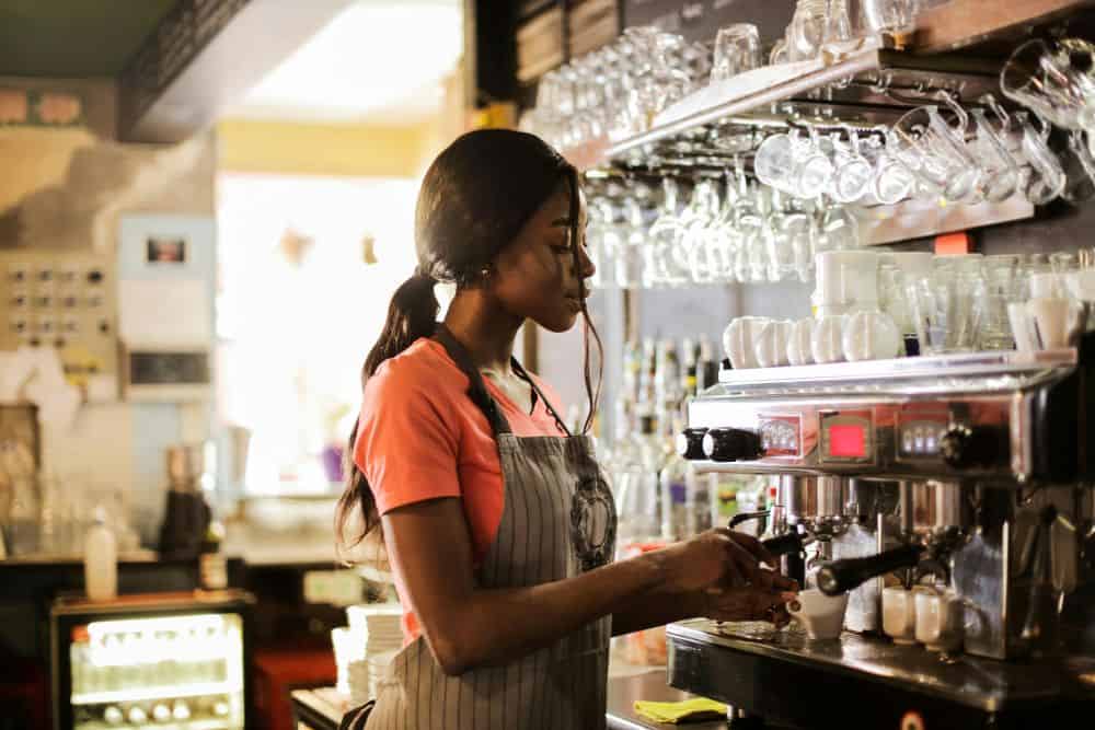 girl making coffee in a coffee shop