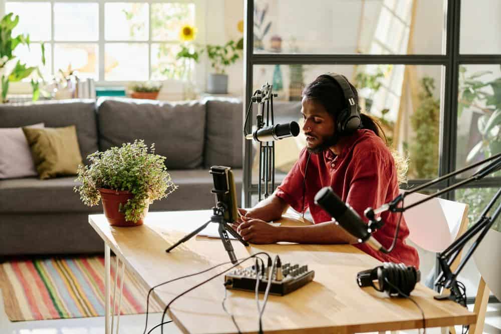 man with headphones on and microphone