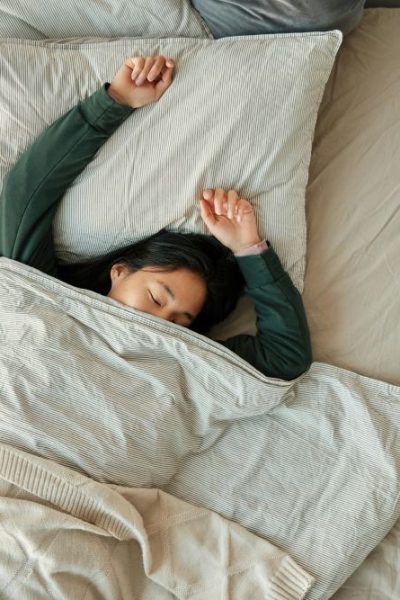 image of person sleeping in bed