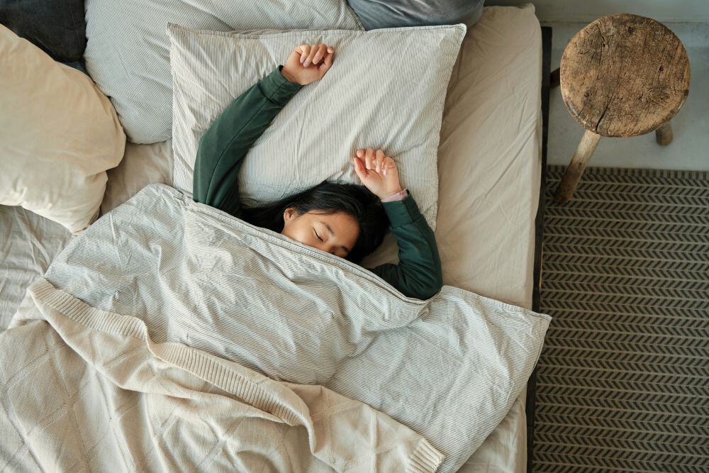 image of person sleeping in bed