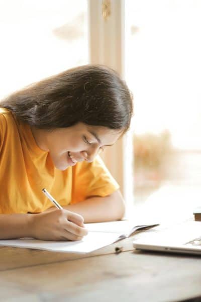 college student working on a laptop