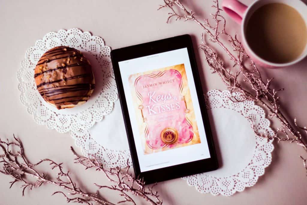 Photo by Jasmin Whiscy tablet showing Keys Kisses card between filled cup and dessert