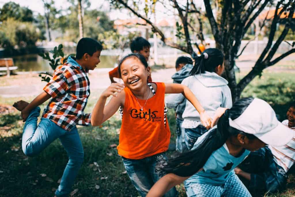Photo by MI PHAM girl running while laughing