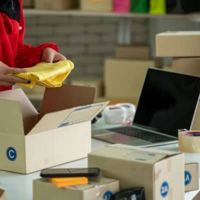 image of person with packages and boxes of items