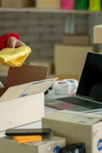 image of person with packages and boxes of items