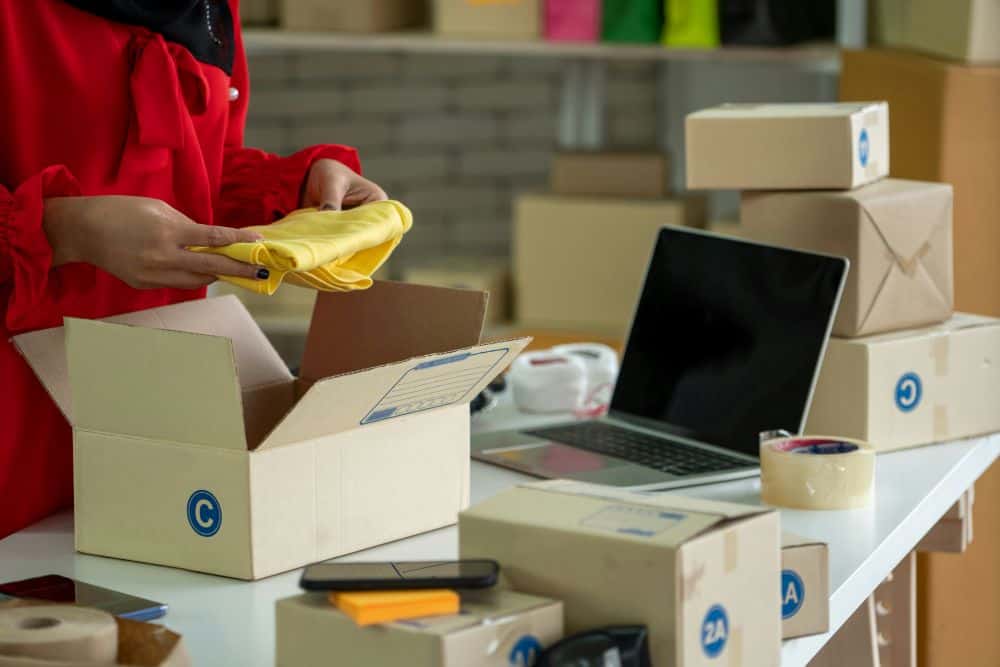 image of person with packages and boxes of items