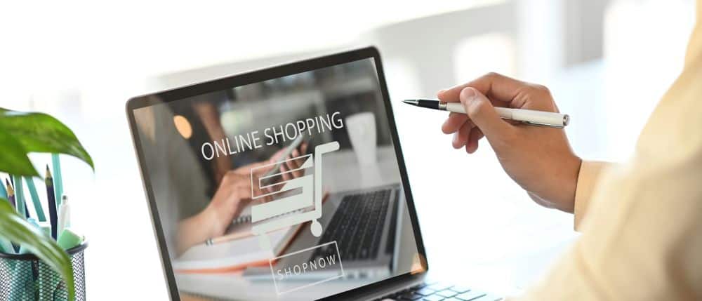 laptop with image on it that says "online shopping"